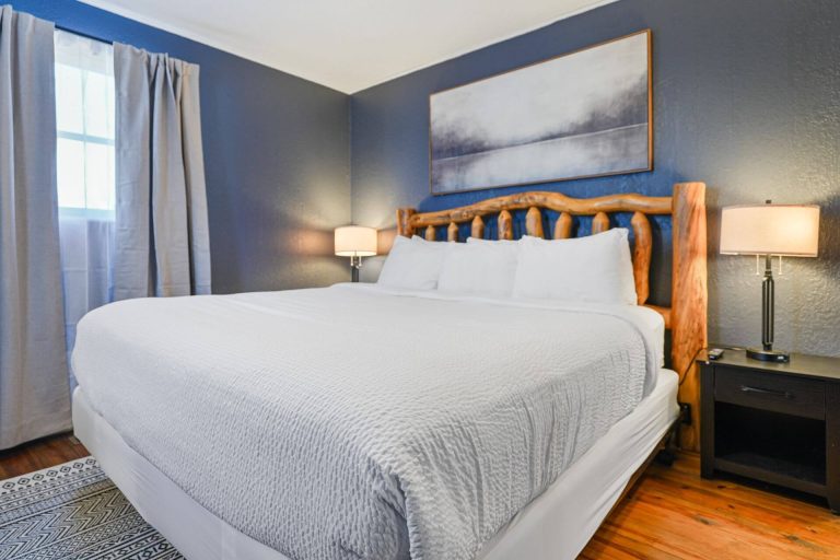 Log-frame bed in the 2-bedroom cabin at Tremont Lodge in Townsend