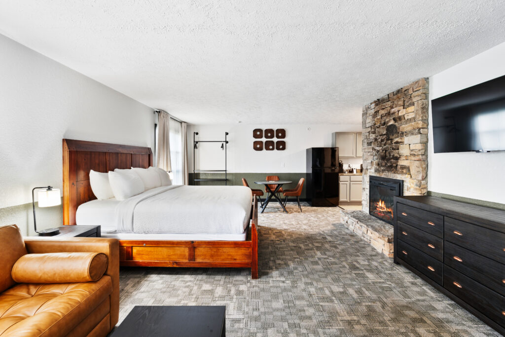 King suite with fireplace and kitchen at Tremont Lodge in Townsend, TN